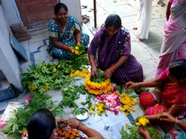 Preparing flowers for the ceremony.